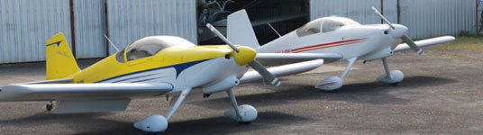aircraft tied down outside hangars